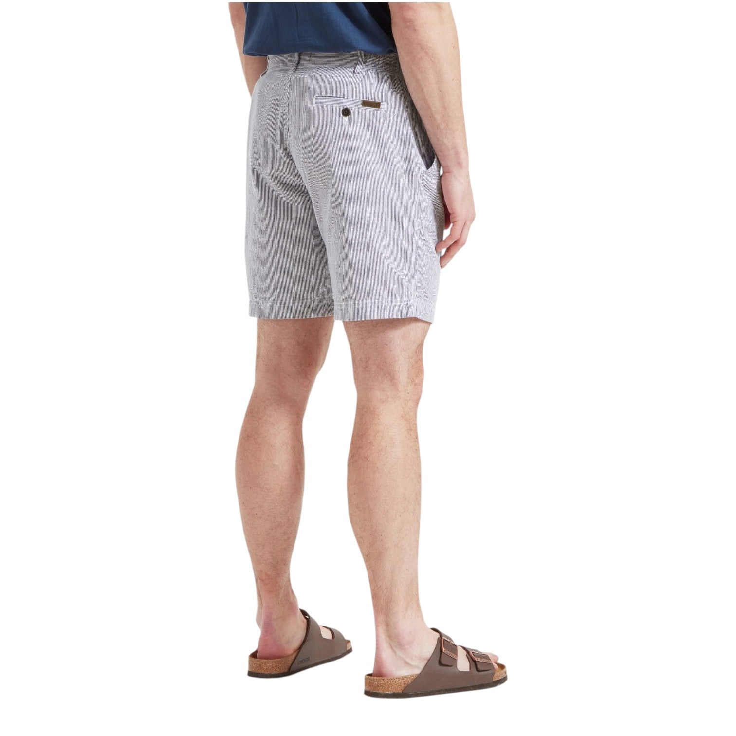 Person wearing light gray shorts on a white background