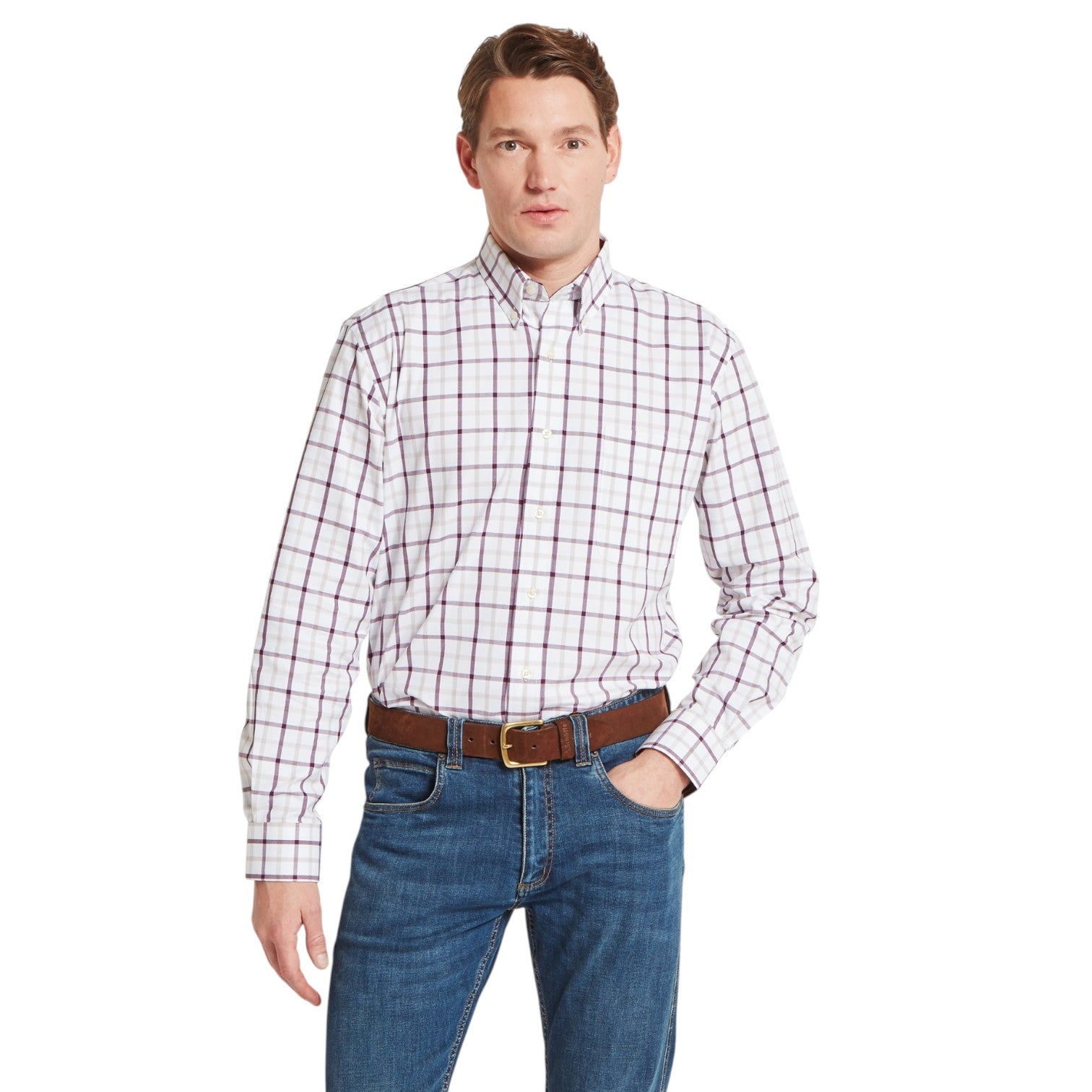 Man wearing a plaid shirt and jeans on a white background