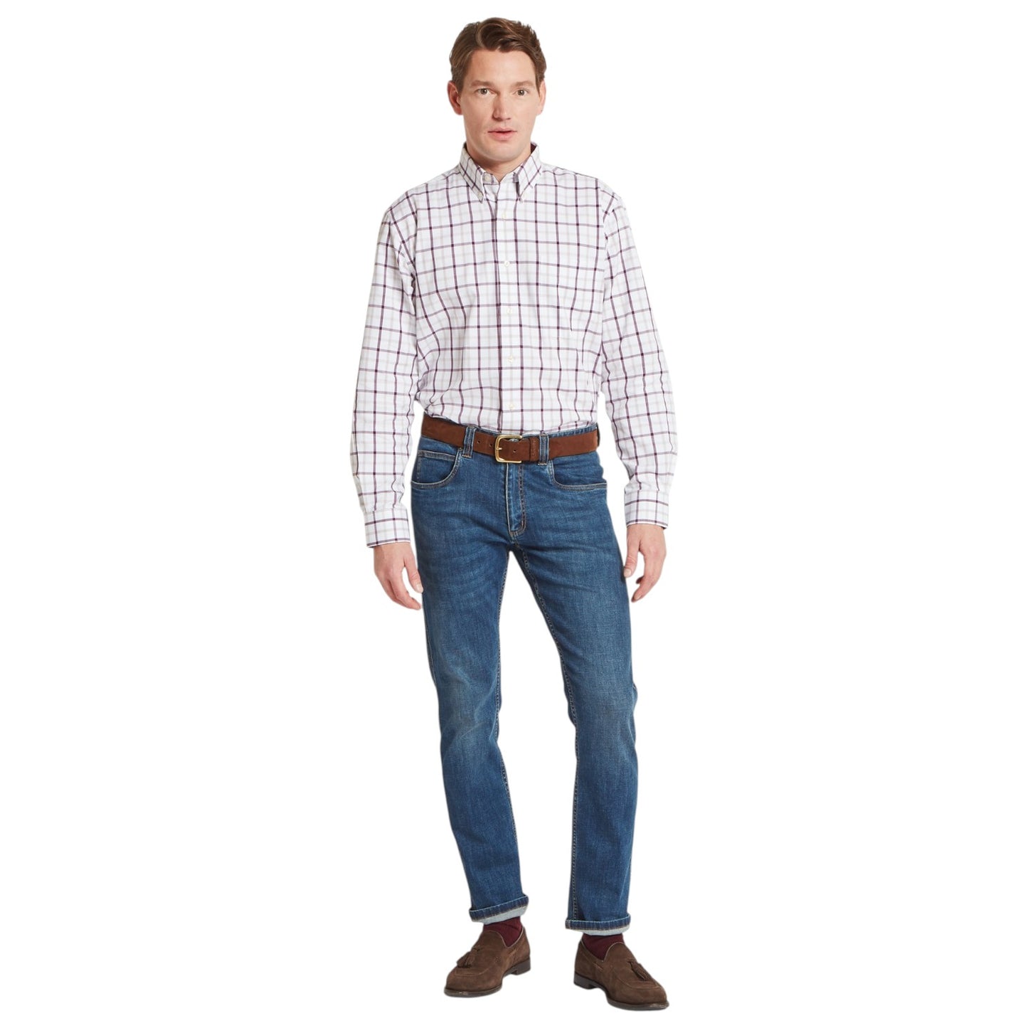 Man wearing a plaid shirt, jeans, and brown shoes on a white background