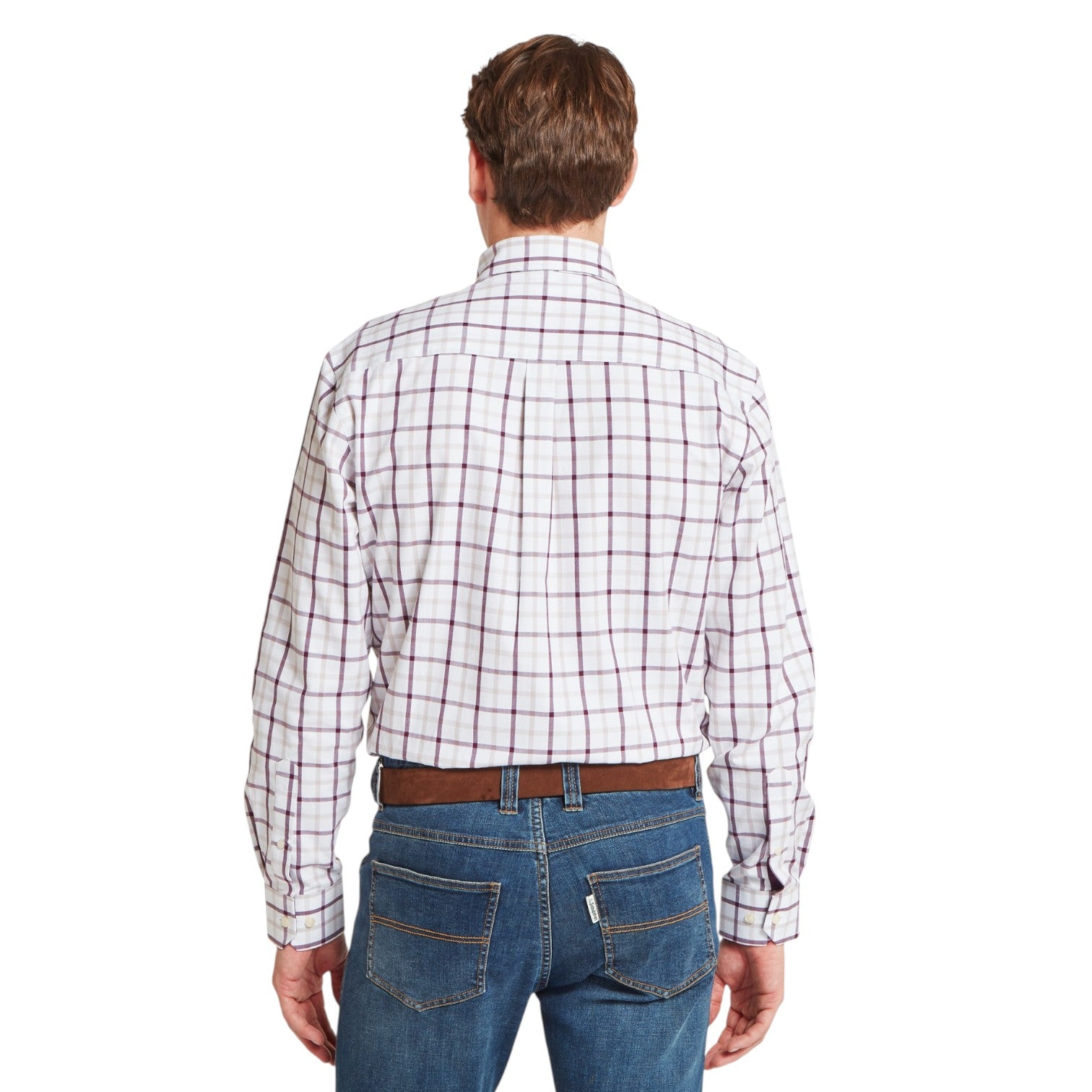 Man wearing a plaid shirt and jeans on a white background