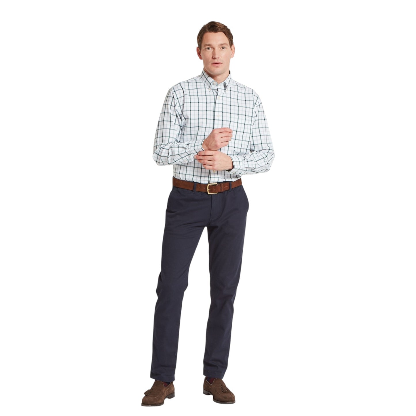 Man wearing a checkered shirt and dark pants on a white background