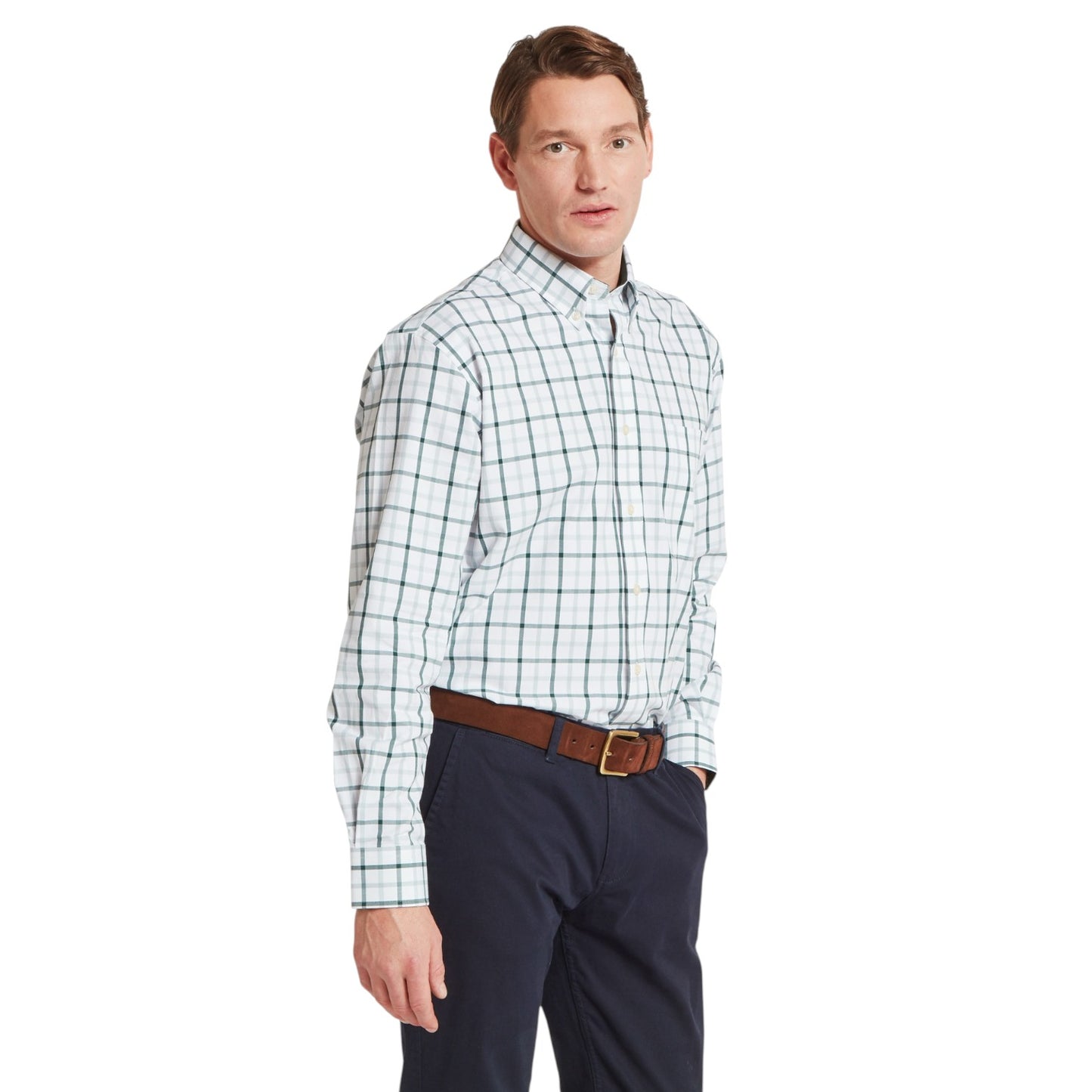 Man wearing a plaid shirt and dark pants on a white background