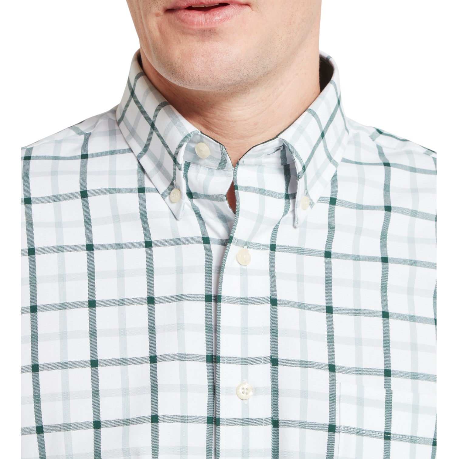 Green and white checkered shirt worn by a person on a white background