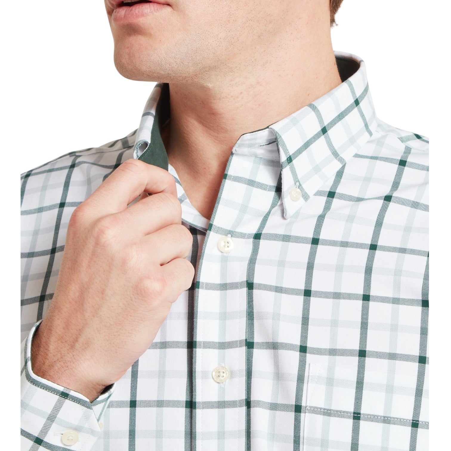 Close-up of a person wearing a green and white checkered shirt with a collar.