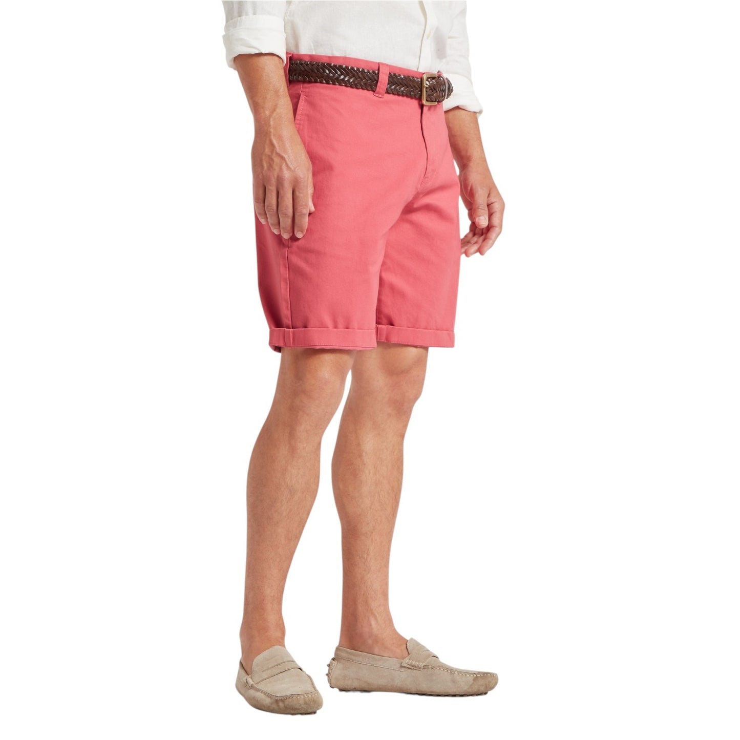 Person wearing pink shorts with a belt on a white background