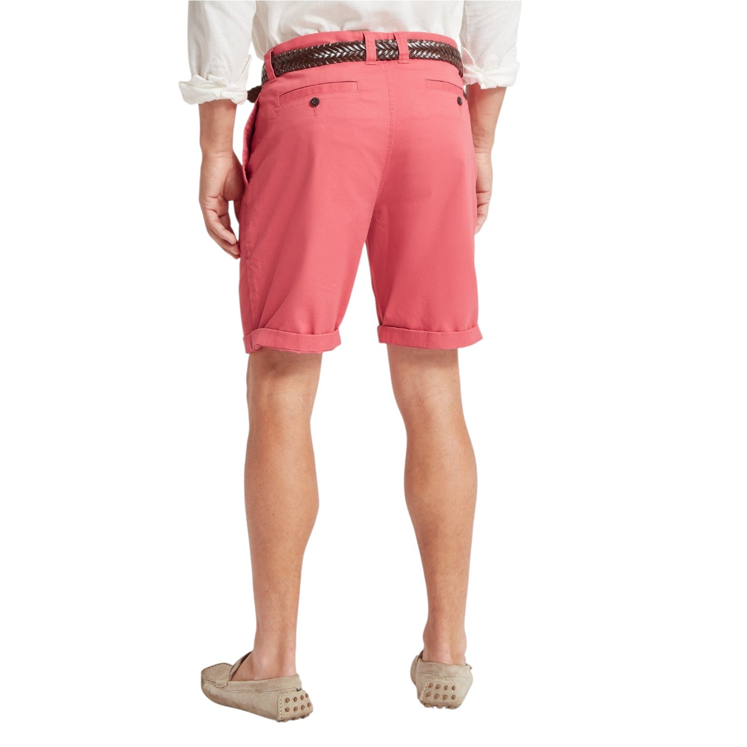Person wearing pink shorts on a white background