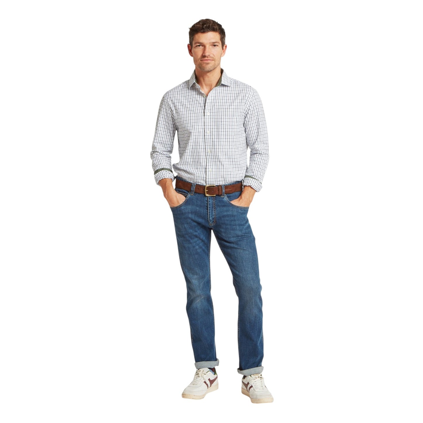 Man wearing a checkered shirt, jeans, and white sneakers on a white background