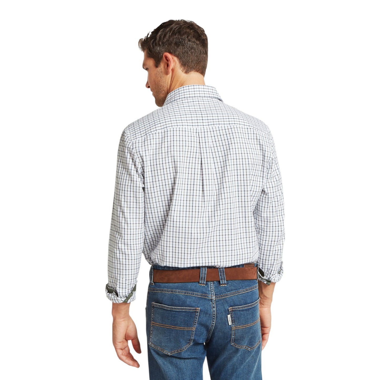 Man wearing a checkered shirt and jeans on a white background
