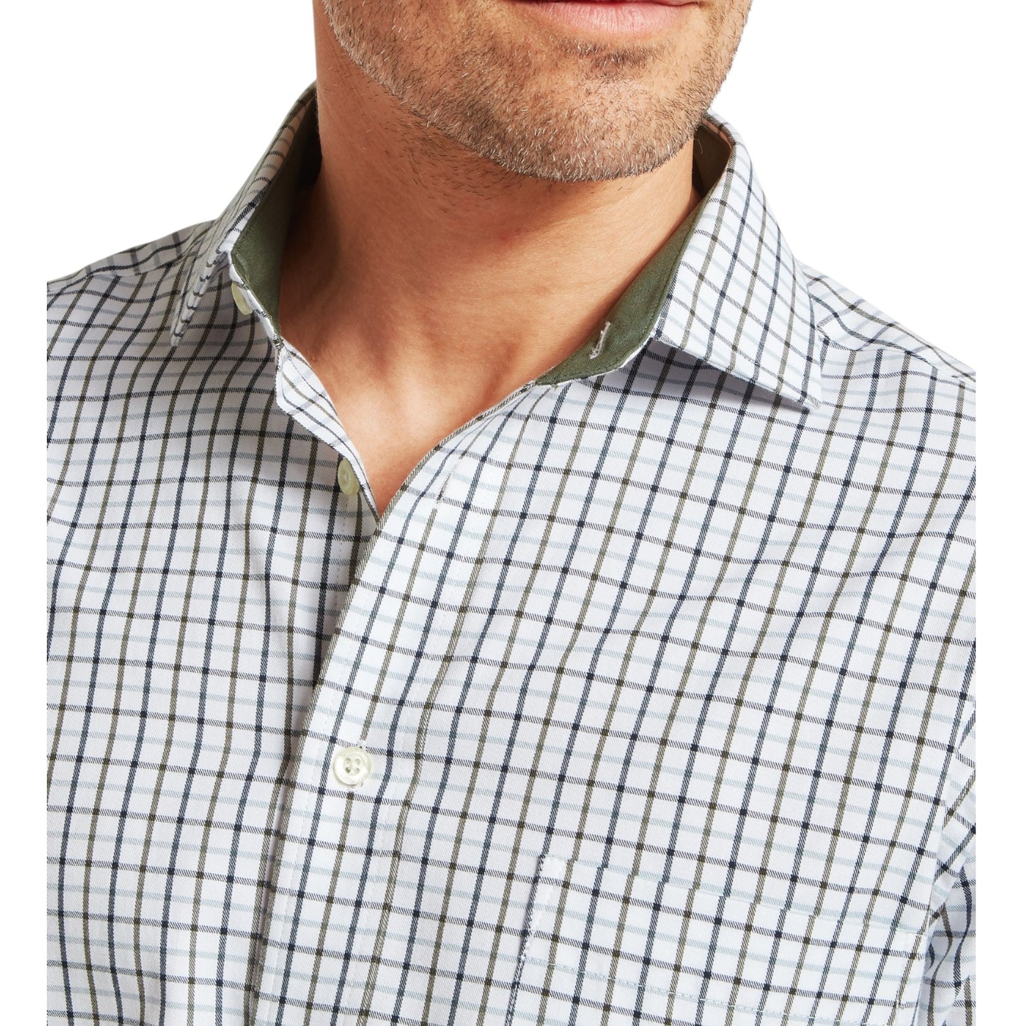 Close-up of a man wearing a checkered shirt with a white background