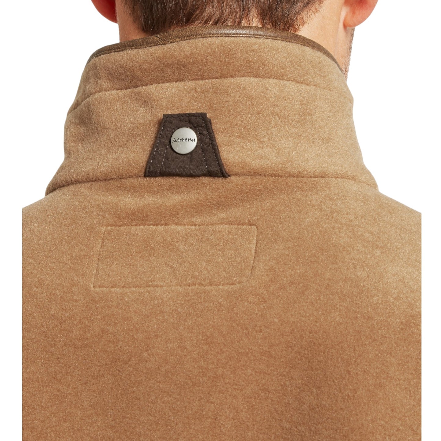 Brown coat with a brand logo on the collar against a white background