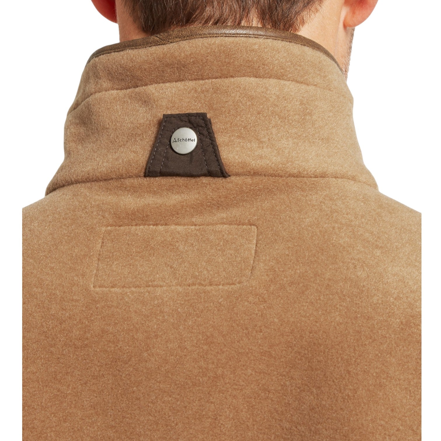 Brown coat with a brand logo on the collar against a white background