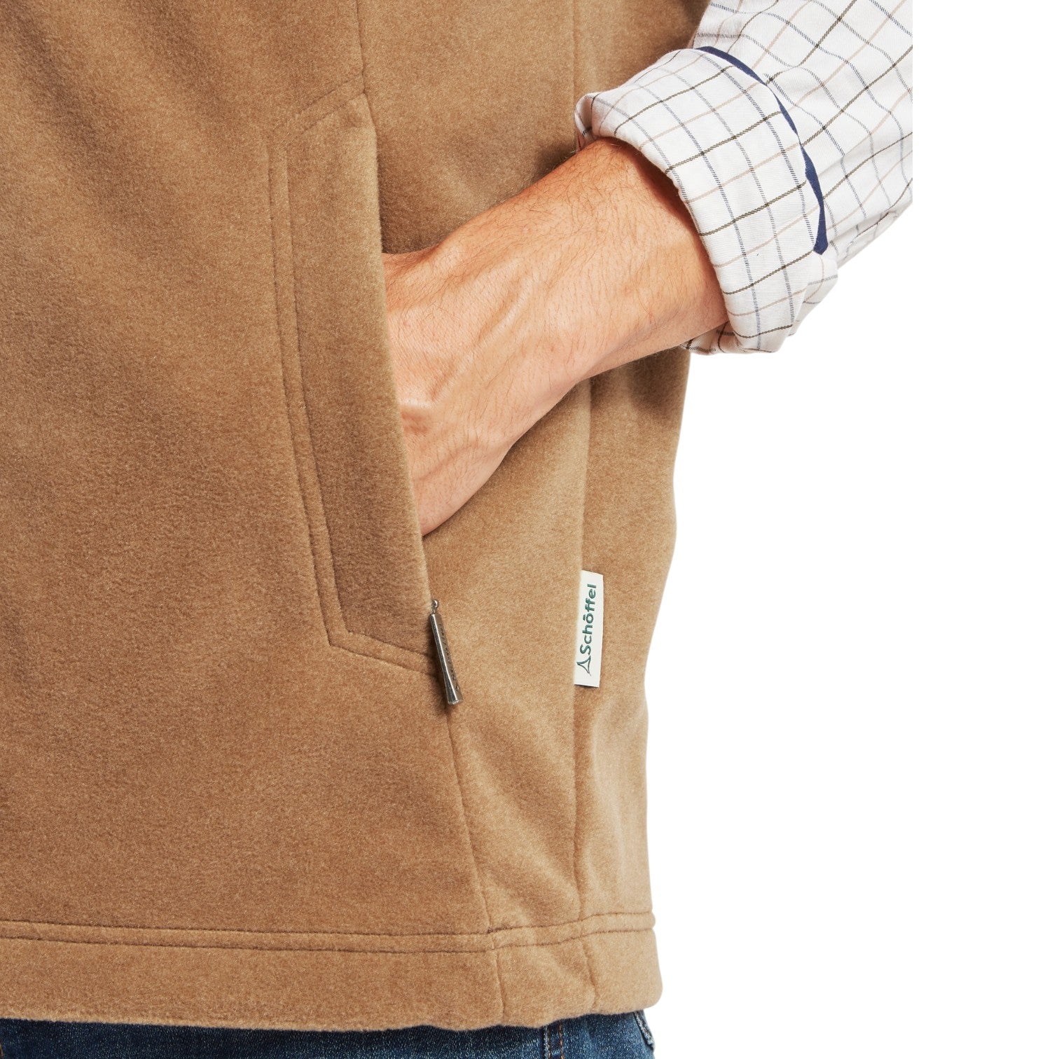 Close-up of a brown fleece jacket with a brand label on a white background