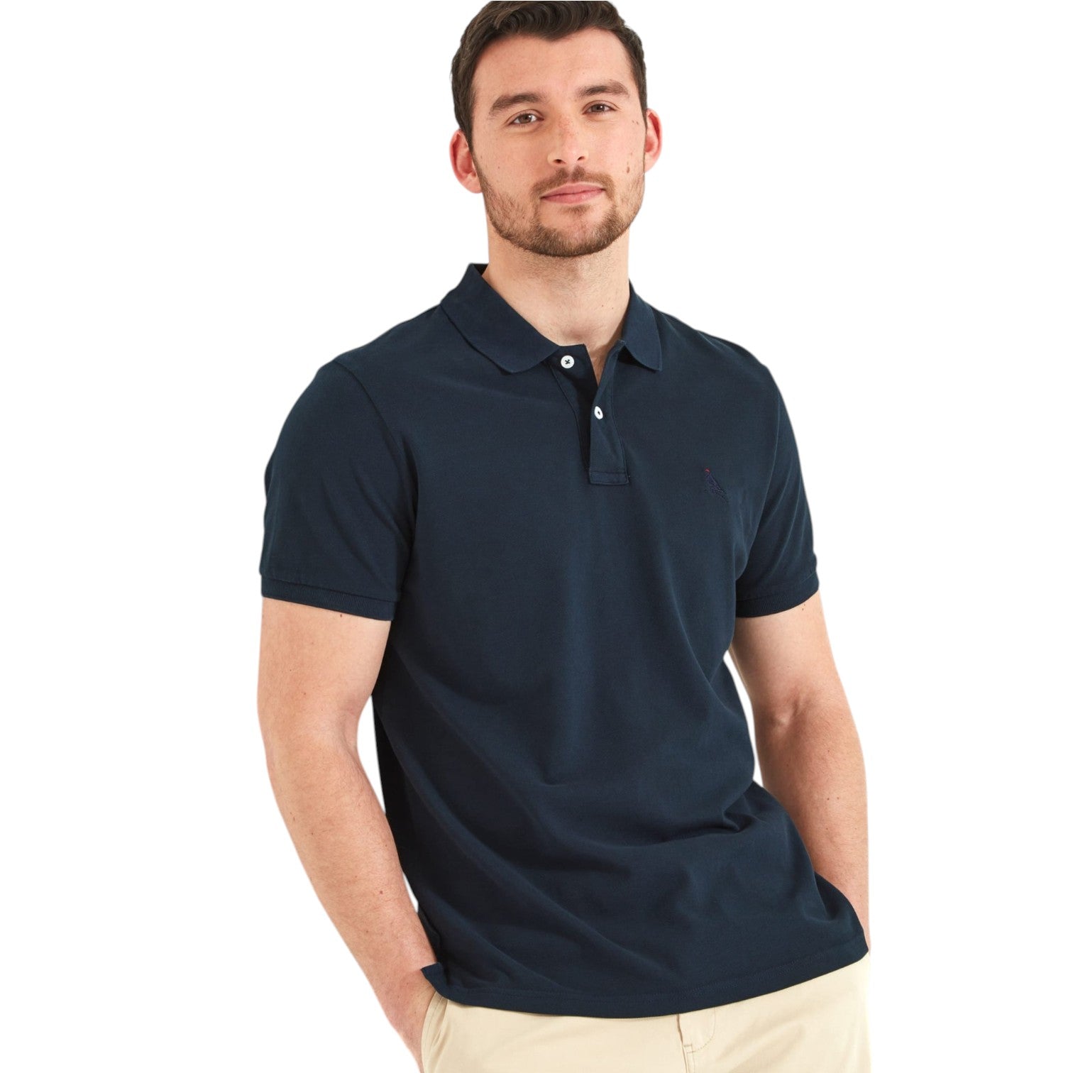 Man wearing a navy blue polo shirt on a white background