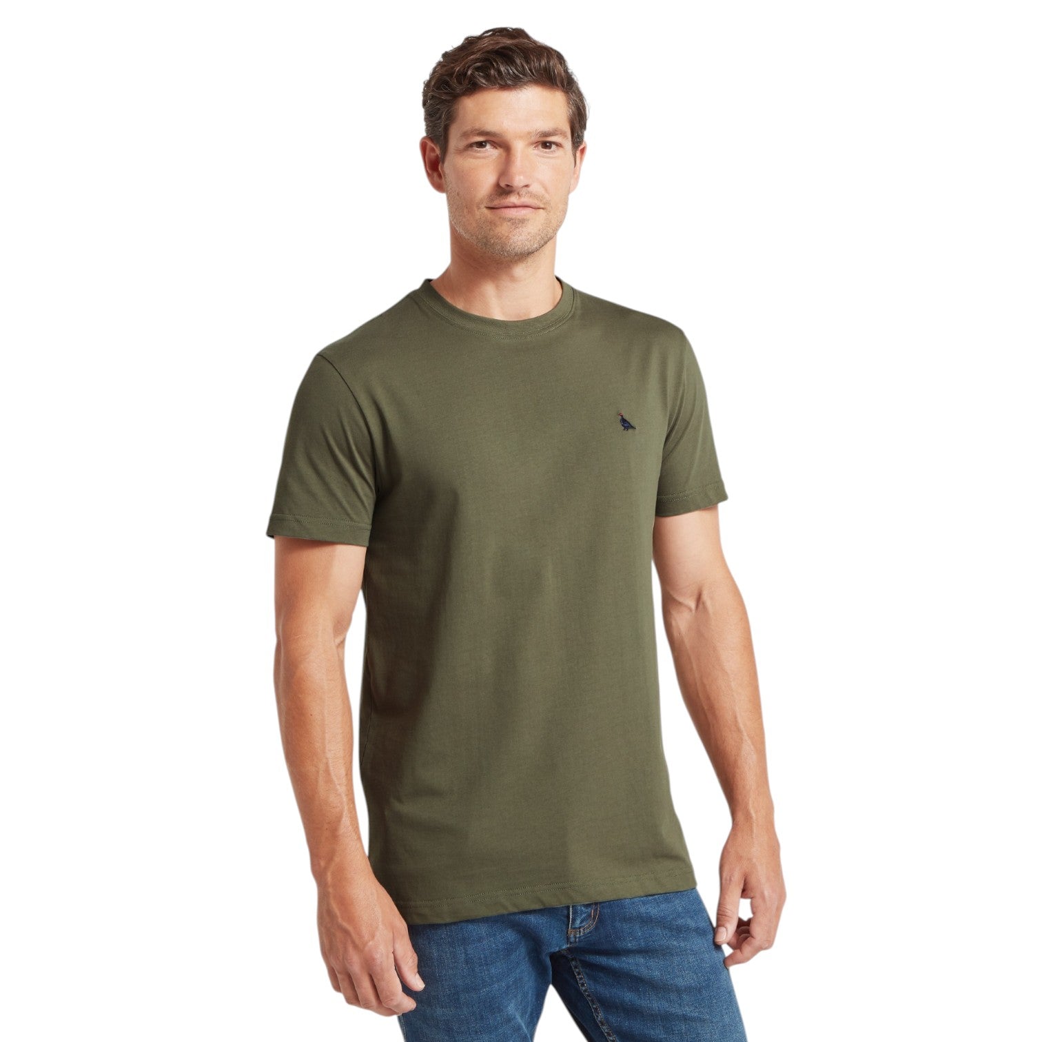 Man wearing an olive green t-shirt with a small logo on a white background