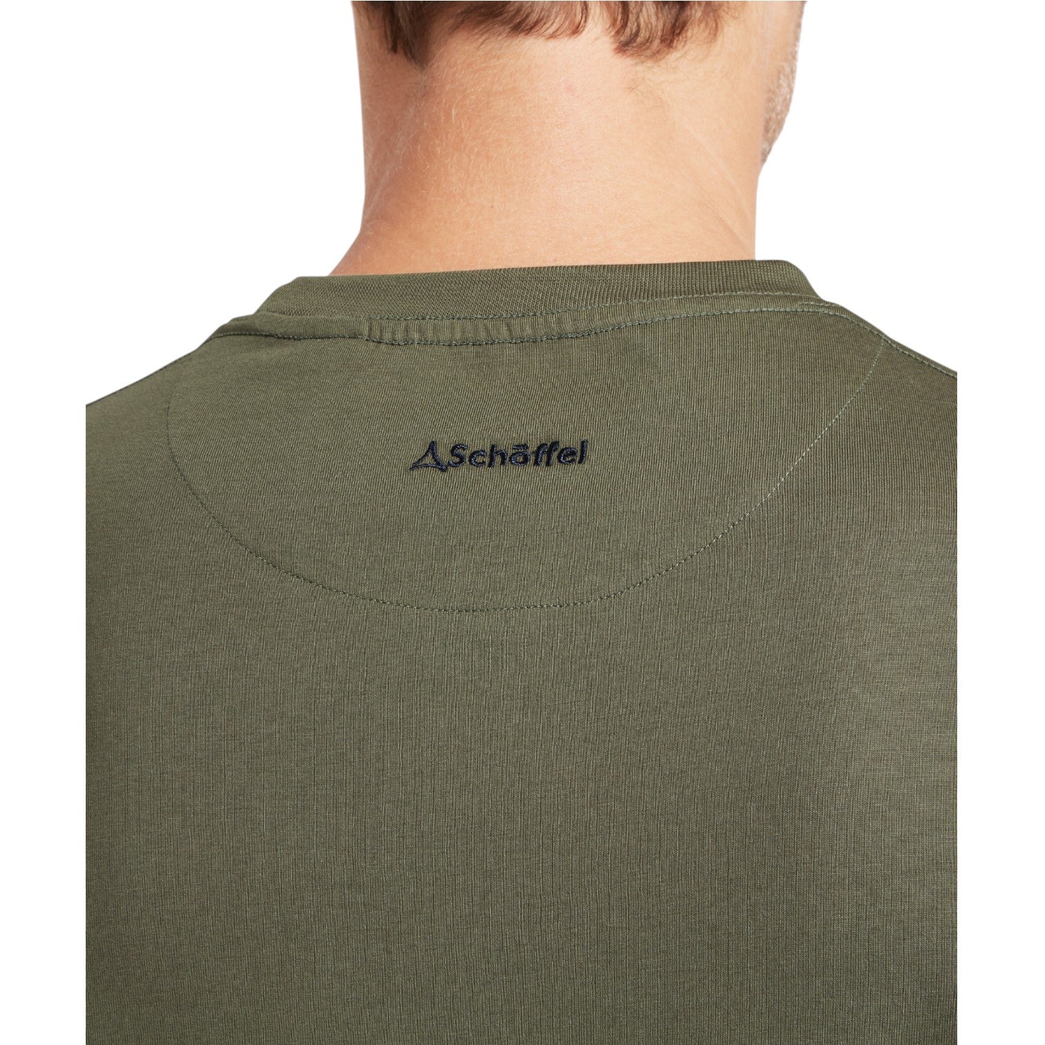 Green t-shirt with a brand logo on the collar against a white background