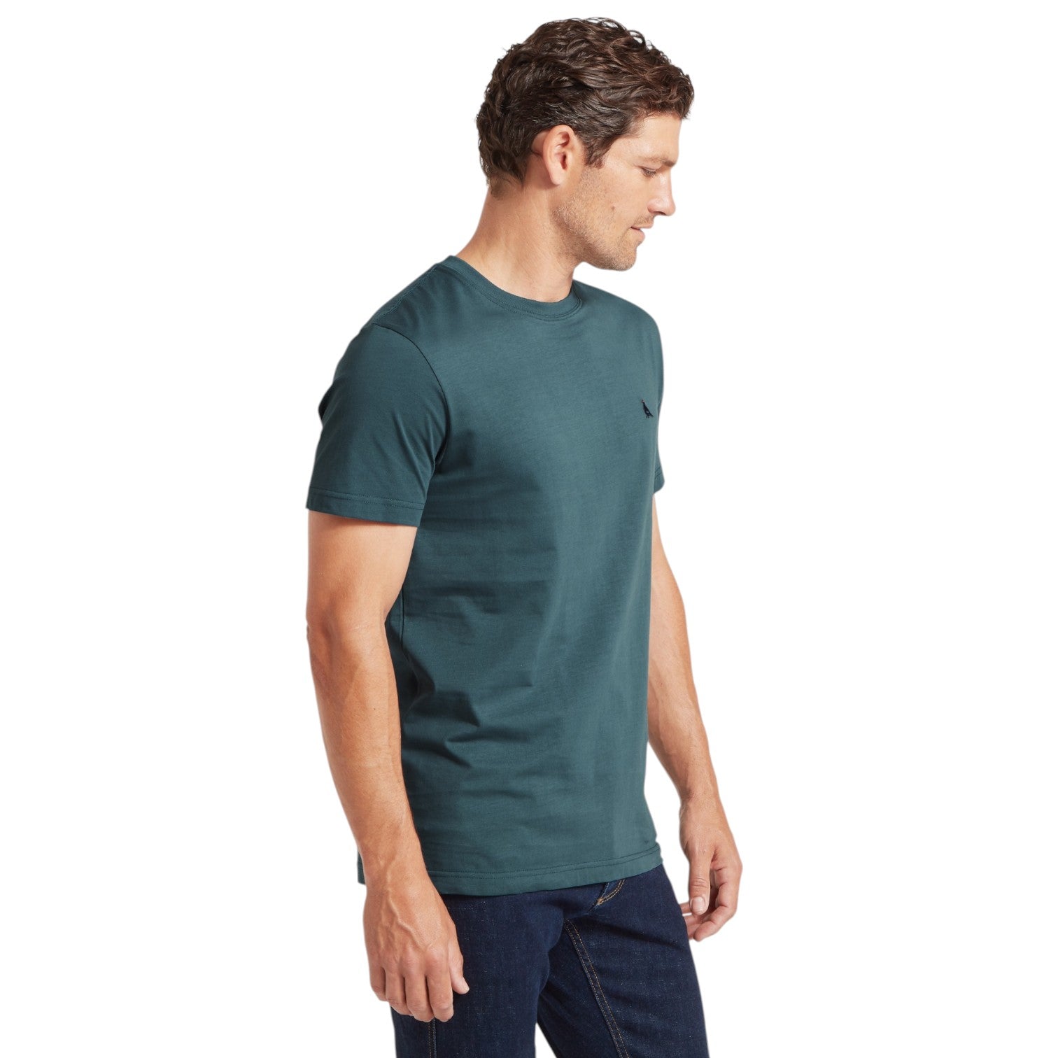 Man wearing a teal t-shirt on a white background