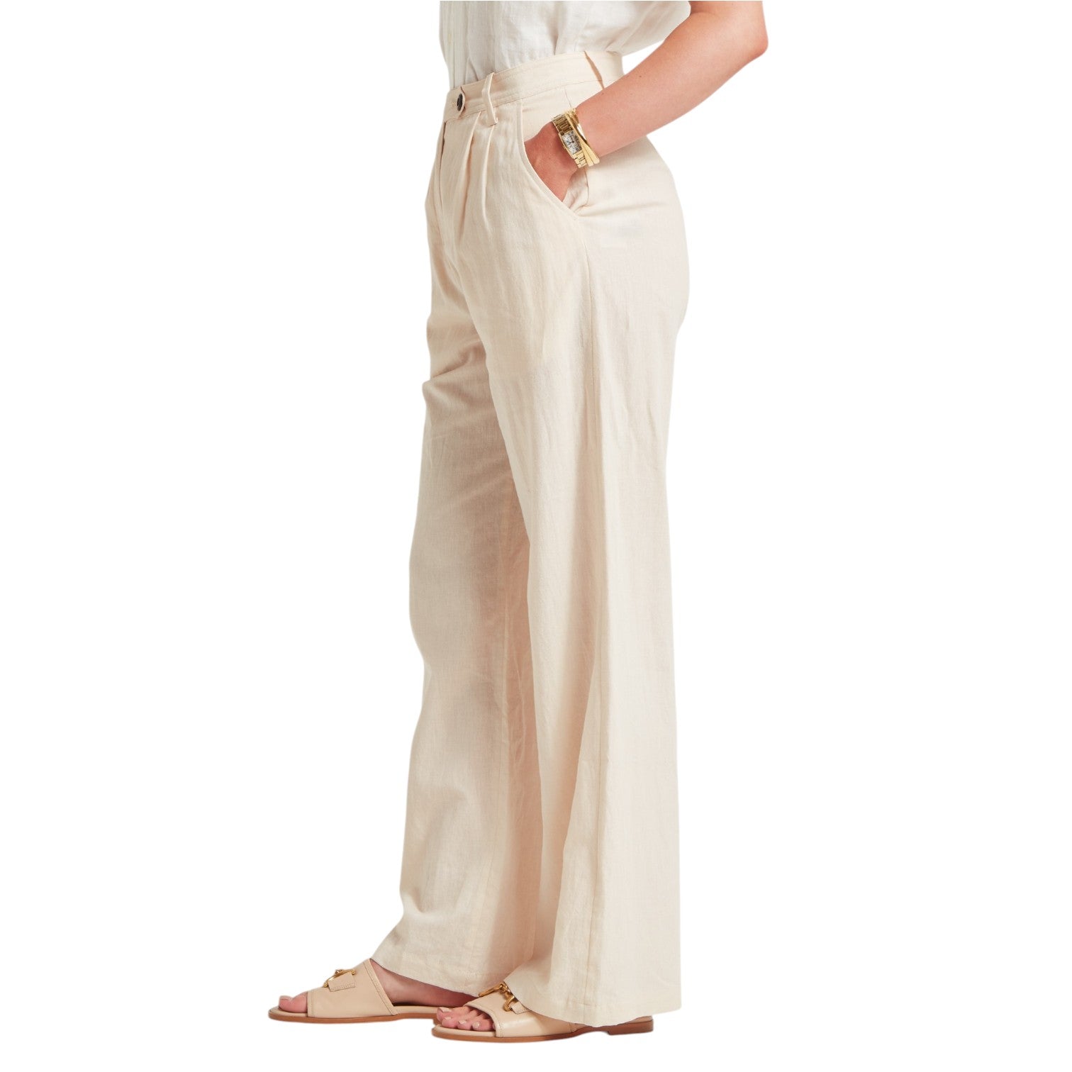 Beige wide-leg pants worn by a person on a white background