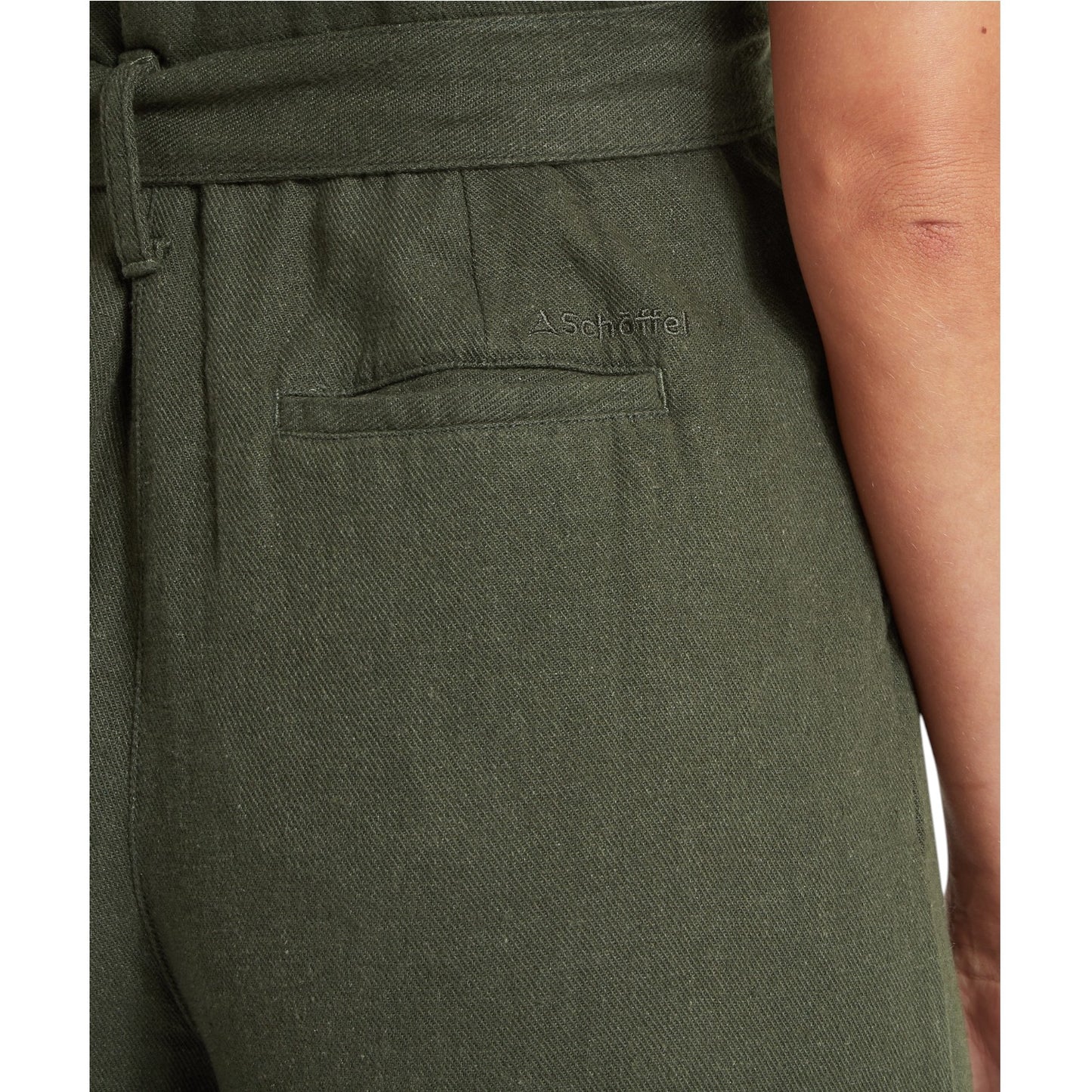 Green pants with a brand logo on a white background