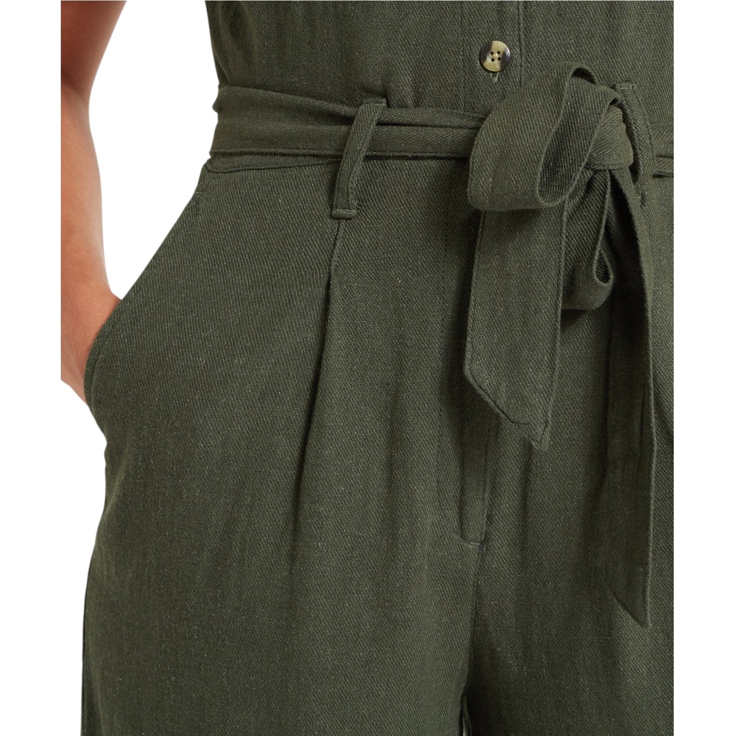 Green pants with a belt and bow detail on a white background