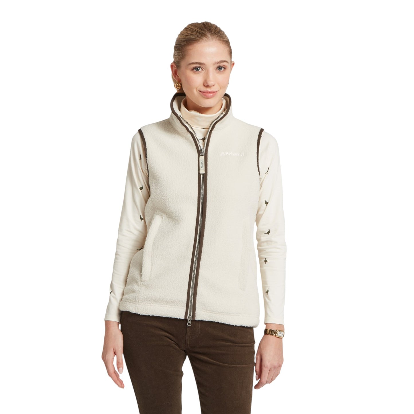Woman wearing a cream-colored fleece jacket on a white background