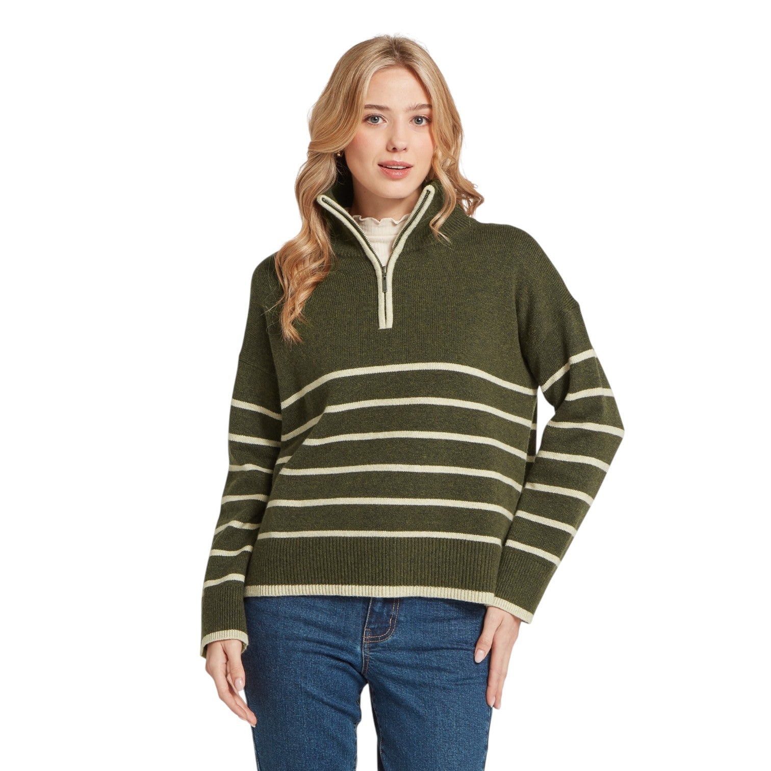 Woman wearing a green and beige striped sweater on a white background
