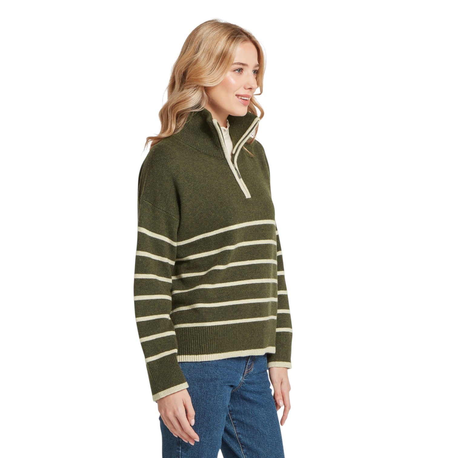 Woman wearing a green and beige striped sweater on a white background