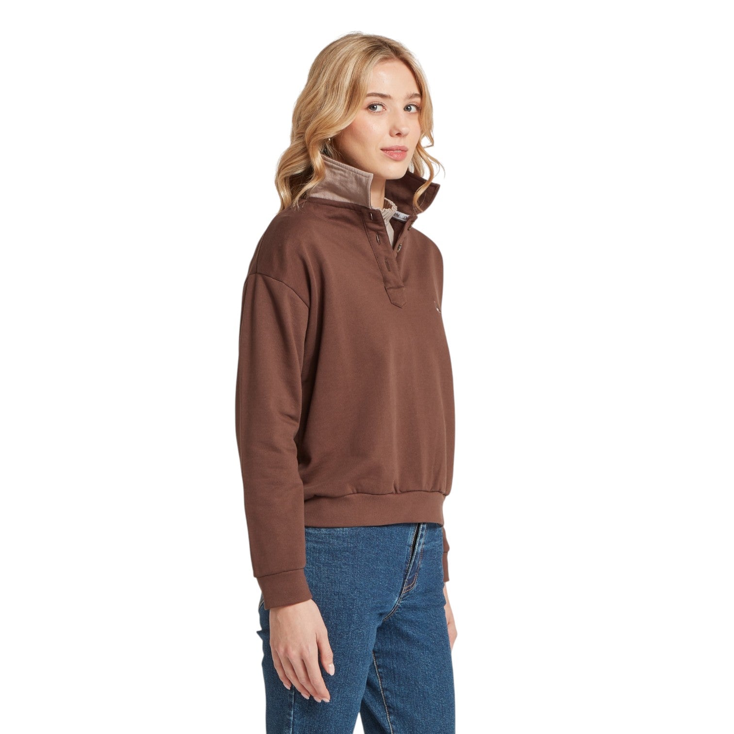 Woman wearing a brown pullover with a white background
