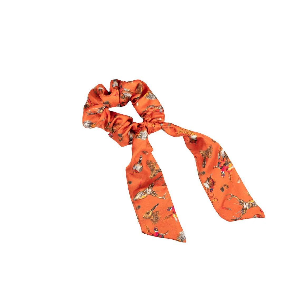 Orange scrunchie with deer pattern on a white background