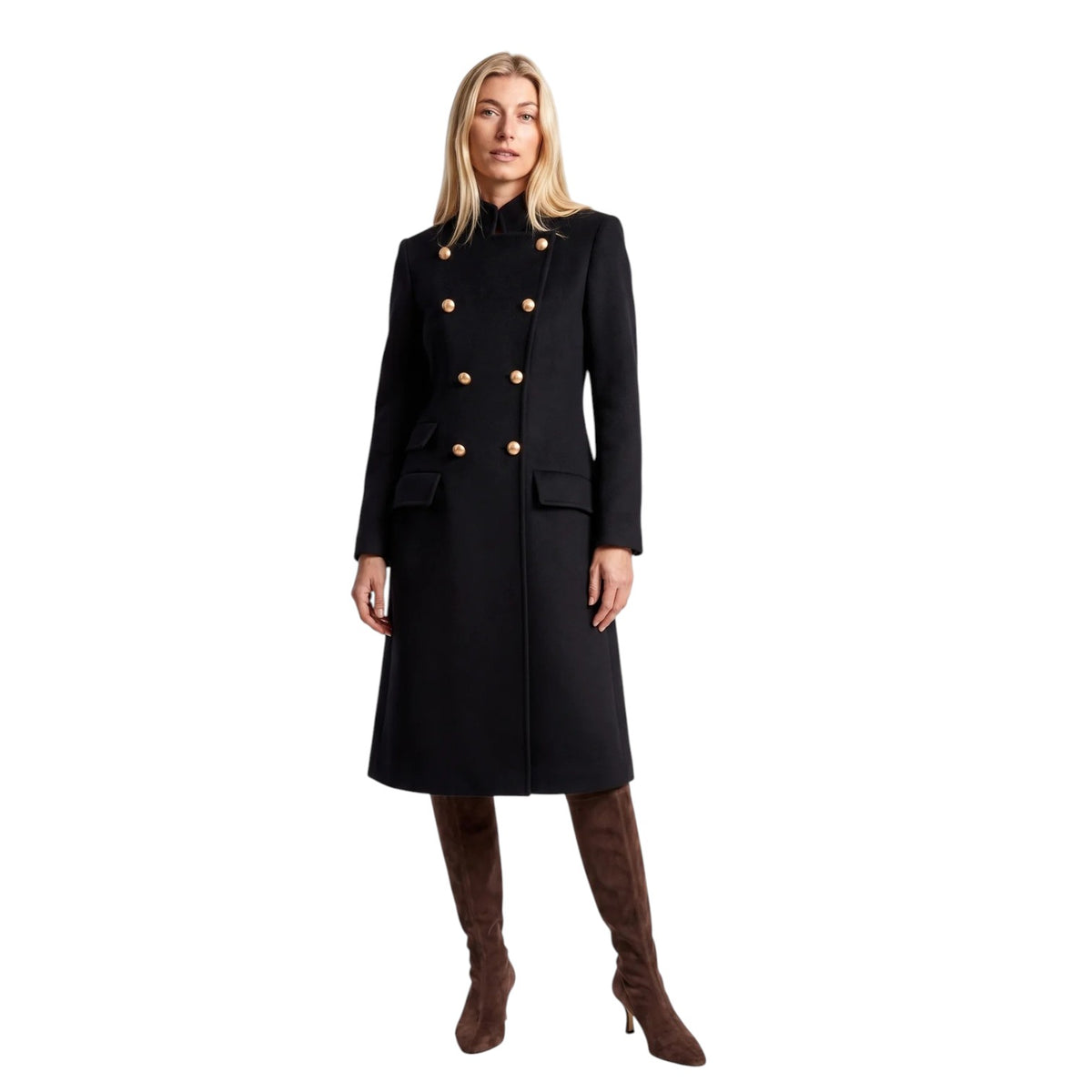 A woman modeling a Navy double-breasted coat with gold buttons, paired with brown knee-high boots, against a solid white background.
